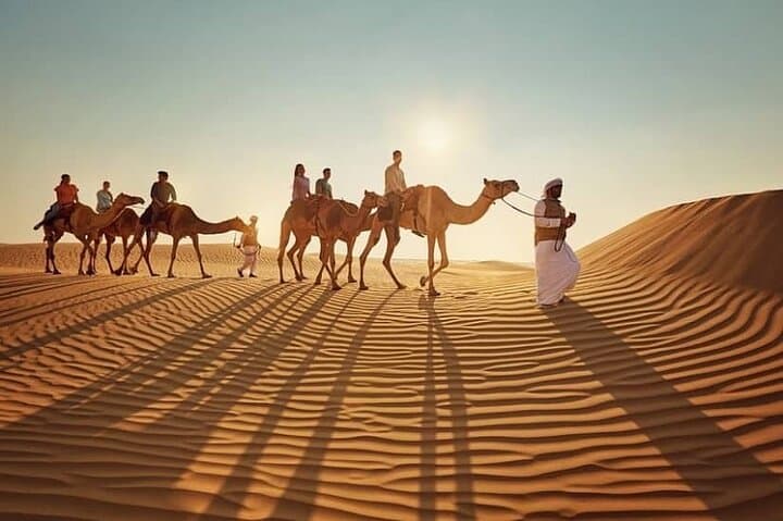 Doha Desert Sunrise & Sunset Tour — Dune Driving, Camel Rides & Sandboarding