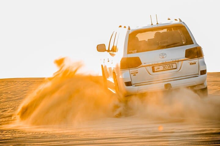 Doha Desert Sunrise & Sunset Tour — Dune Driving, Camel Rides & Sandboarding photo 4