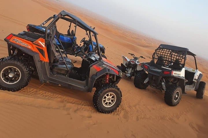 30-Minute Dubai Quad Biking Self-Drive: Red Dunes Adventure with Sandboarding & Camel Ride photo 2