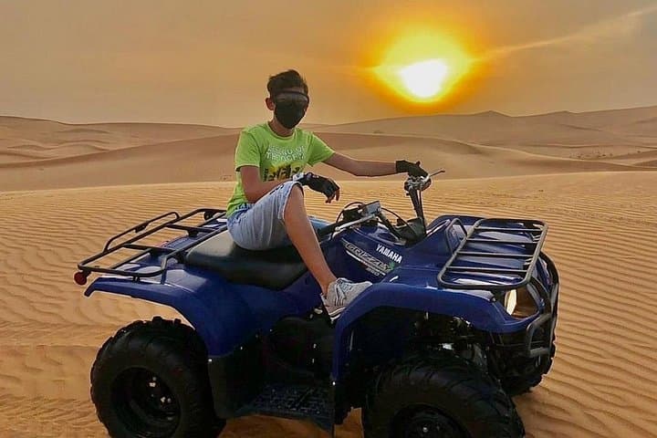 30-Minute Dubai Quad Biking Self-Drive: Red Dunes Adventure with Sandboarding & Camel Ride photo 4