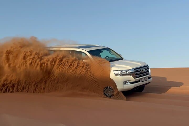 Sunrise Dubai Desert Safari: Morning Dune Bashing & Sandboarding