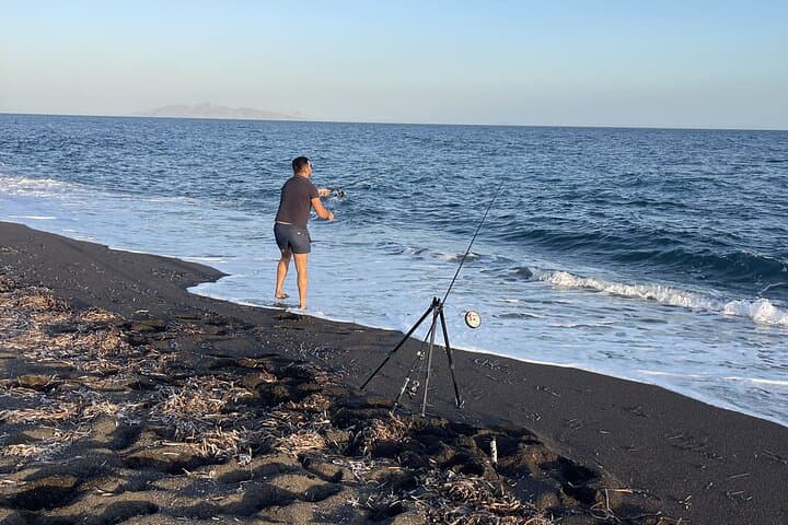 Monolithos Volcanic-Beach Fishing: Santorini Sunset Rod & Swim Experience photo 1