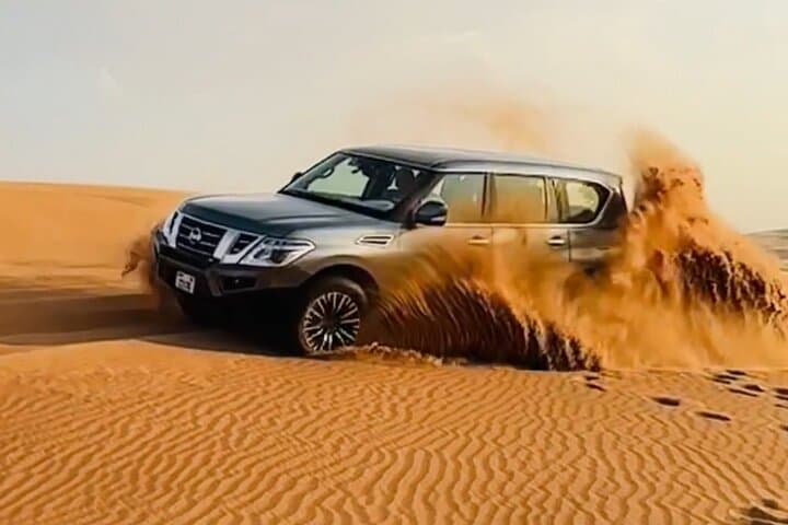 Dubai Sunrise Desert Safari With Camel Ride — Dune Bashing & Sandboarding at Dawn photo 3