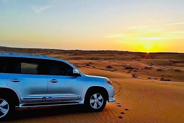 Red Dunes Lahbab Desert Safari — Dune Bashing, Sandboarding & BBQ in Dubai