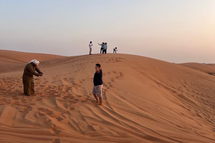 Dubai Evening Red Sand Safari: Dune Bashing, Camel Ride, Sandboarding & BBQ photo 4