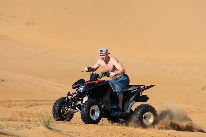 Dubai Red Dune Desert Safari: Quad Biking, Camel Ride & BBQ Dinner