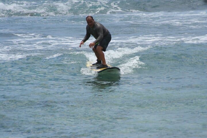 Sunny Po'ipu Semi-Private Surf Lesson: Learn to Ride Kauai Waves photo 5