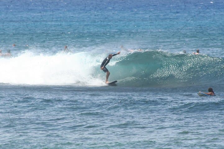 Sunny Po'ipu Semi-Private Surf Lesson: Learn to Ride Kauai Waves photo 6