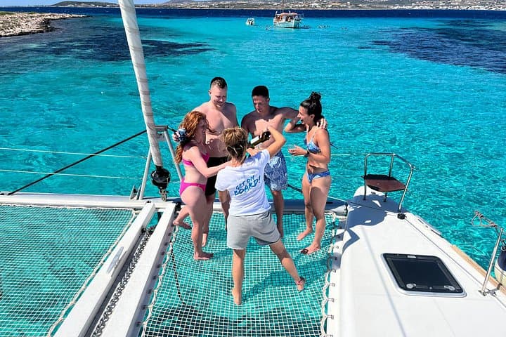Private Catamaran Cruise from Paros — Swim Hidden Caves & Enjoy a Greek Lunch photo 1
