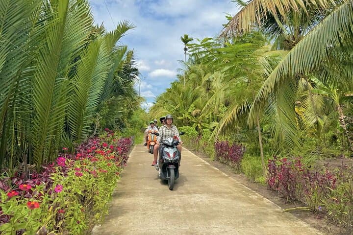 Real Mekong Delta: Authentic Farm, Scooter, Boat & Market Day Tour from Ho Chi Minh City