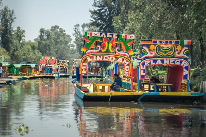 Xochimilco and Coyoacán Day Tour from Mexico City — Trajinera Ride, Frida Kahlo, and UNAM Murals