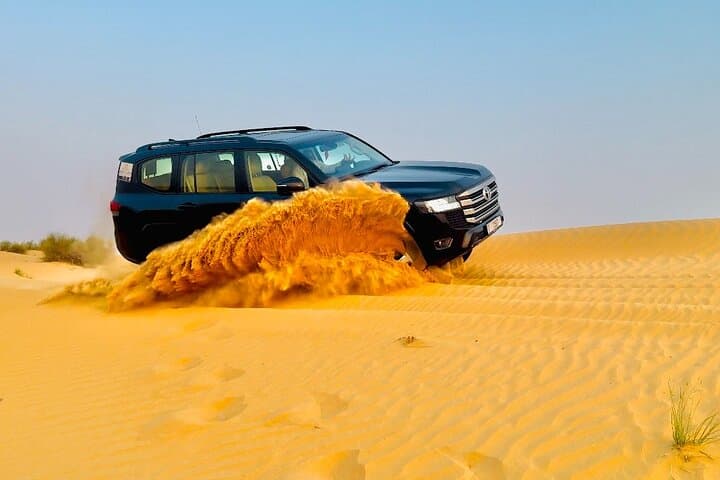 Premium Dubai Desert Safari: Dune Bashing, Sandboarding, Camel Ride & BBQ Experience