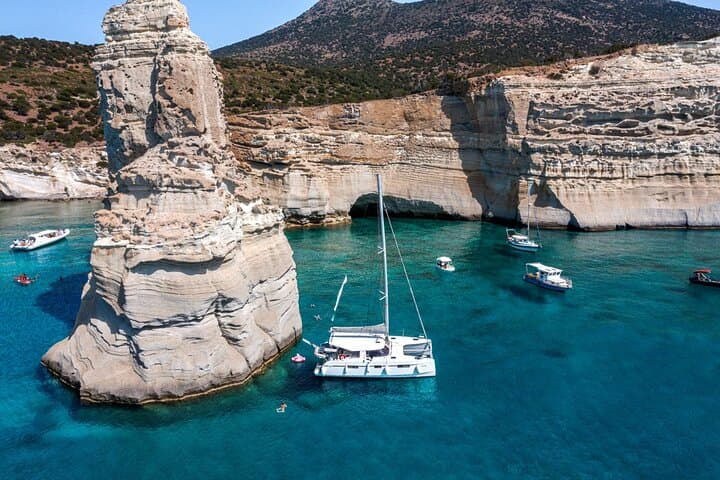 Sunset Catamaran Cruise to Kleftiko Bay, Milos — Dinner, Snorkel & SUP