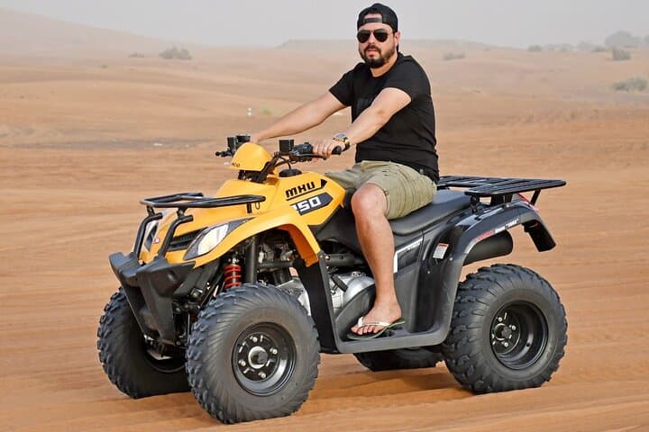 Sunset Quad‑Bike Desert Safari in Dubai with BBQ & Live Shows