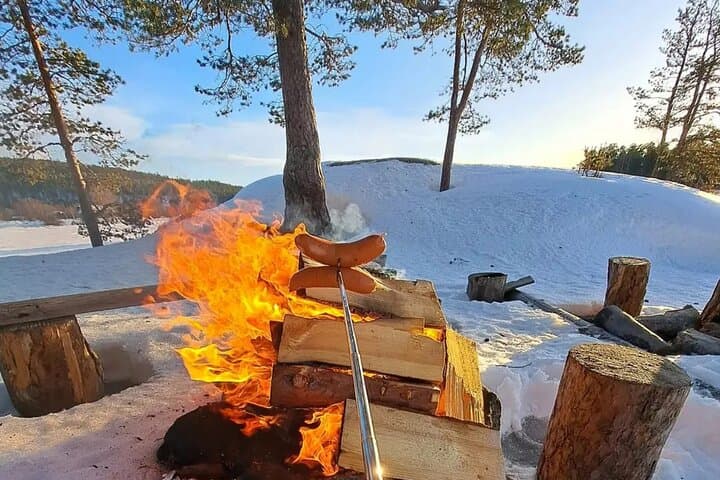 Ice Fishing on Lake Inari: Saariselkä Snowmobile & Sleigh Adventure photo 4