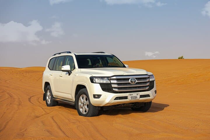 Desert Safari Dubai — Lehbab Dune Bashing, Sandboarding & Bedouin Camp Experience