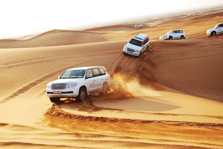 Dubai Desert Safari: Dune Bashing, Camel Rides, Sunset Camp & BBQ Experience