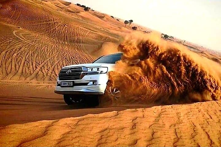Dubai Evening Desert Safari: Dune Bashing, Camel Rides & BBQ Camp