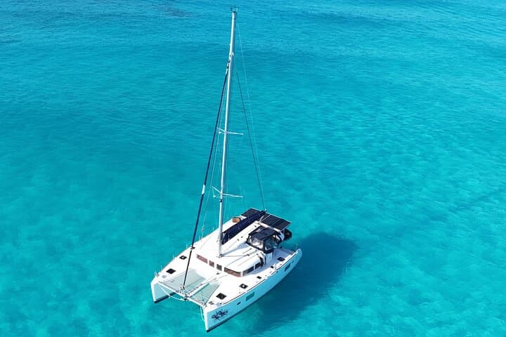 Private Catamaran Tour to Isla Mujeres: Full-Day Sail, Snorkel & Beach Club Experience photo 3