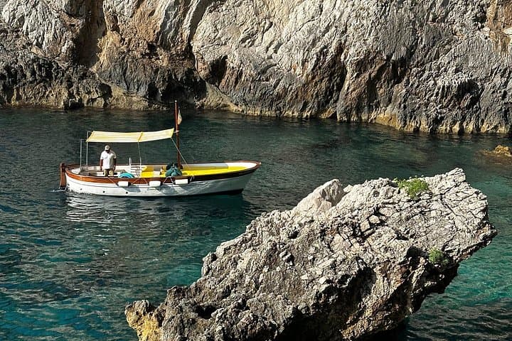 Private 3-Hour Capri Boat Tour: Faraglioni, Blue Grotto & Swim Stops photo 3