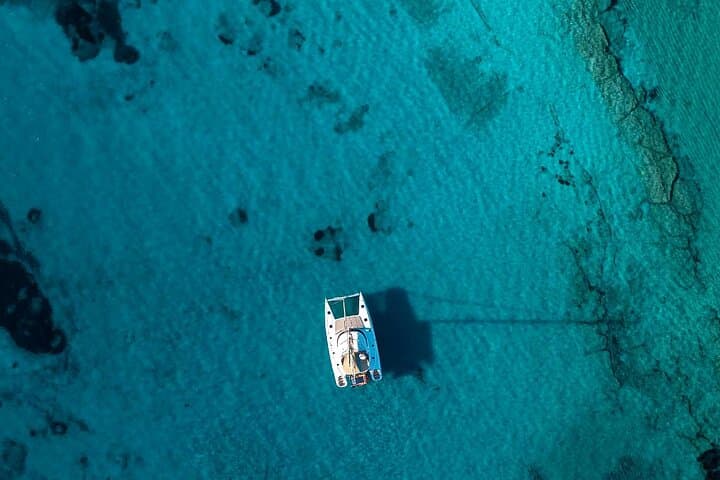 Mykonos Catamaran Private Day Cruise with Full Lunch & Open Bar to Rhenia and South Beaches photo 6
