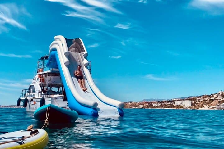 Benalmádena Private Boat Tour: Snorkel Shipwreck, Slide & Paddleboard photo 2