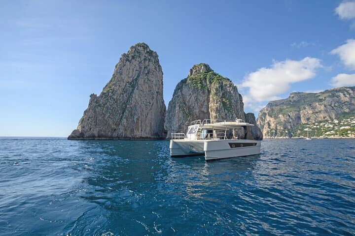 Capri Catamaran Private Boat Tour: Blue Grotto, Faraglioni & Hidden Coves photo 6