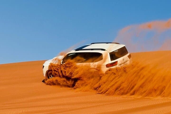 Evening Dubai Desert Safari: Dune Bashing, Camel Rides & Bedouin Camp Experience