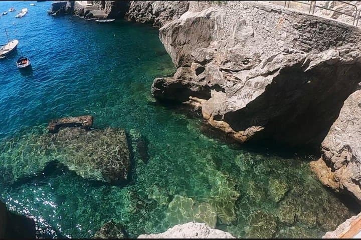 Private Boat Tour from Positano to Capri — Blue Grotto, Faraglioni & Li Galli photo 3