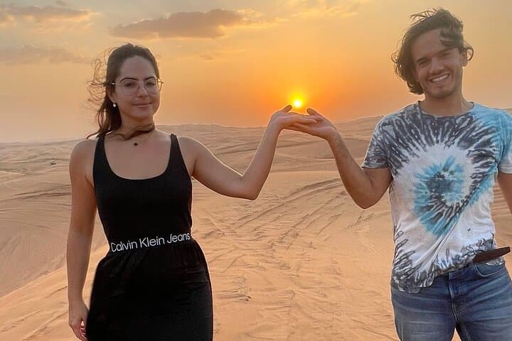 Dubai Evening Desert Safari with Camel Ride, Sandboarding & BBQ