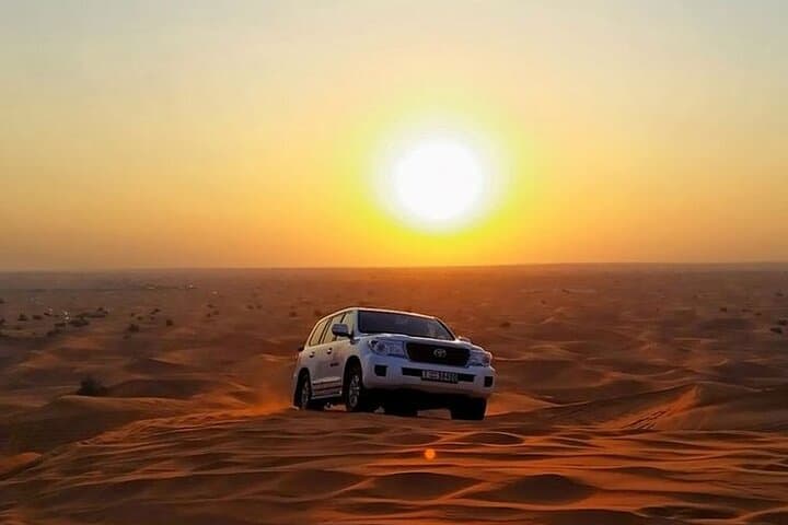 Private Morning Safari Dubai: Sunrise Dune Bashing, Camel Rides & Sandboarding