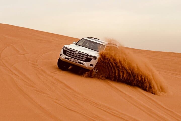 Dubai Red Dunes Sunrise & Sunset Desert Safari with Camel Ride, Falconry and Sandboarding