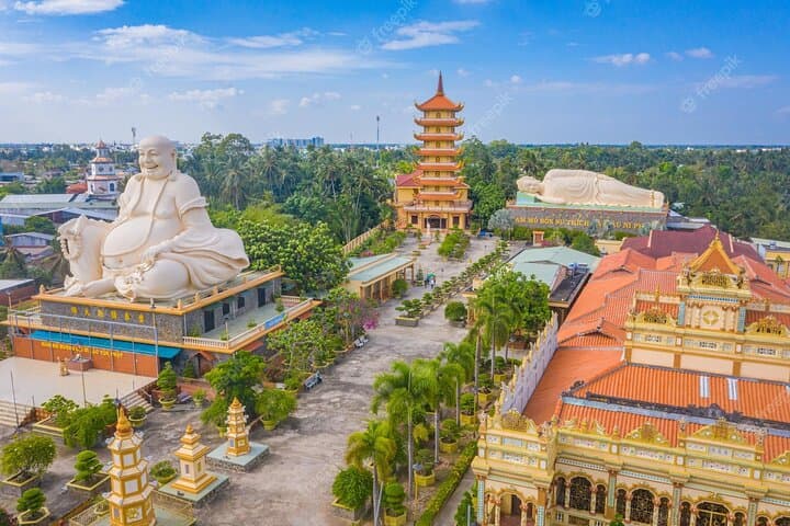 Mekong Delta Day Trip from Ho Chi Minh City — Boat Cruises, Coconut Candy & Vinh Trang Pagoda photo 4