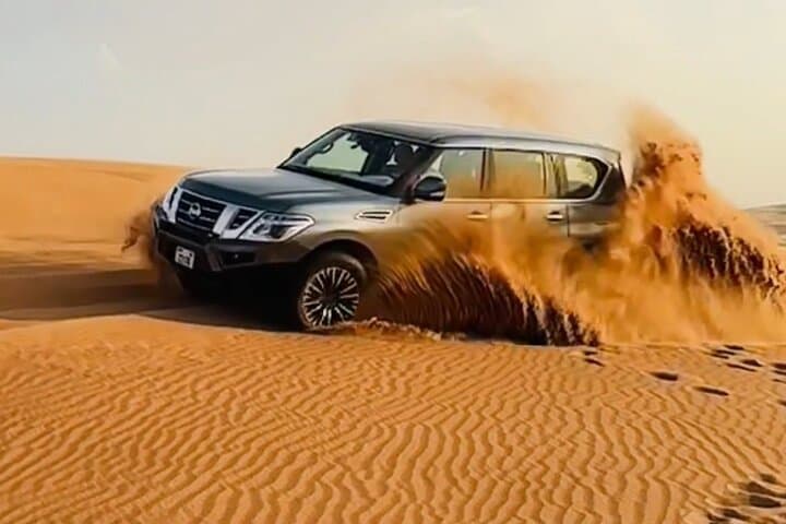 Dubai Evening Desert Safari: Sunset Dune Bashing, BBQ Dinner & Camel Ride photo 2