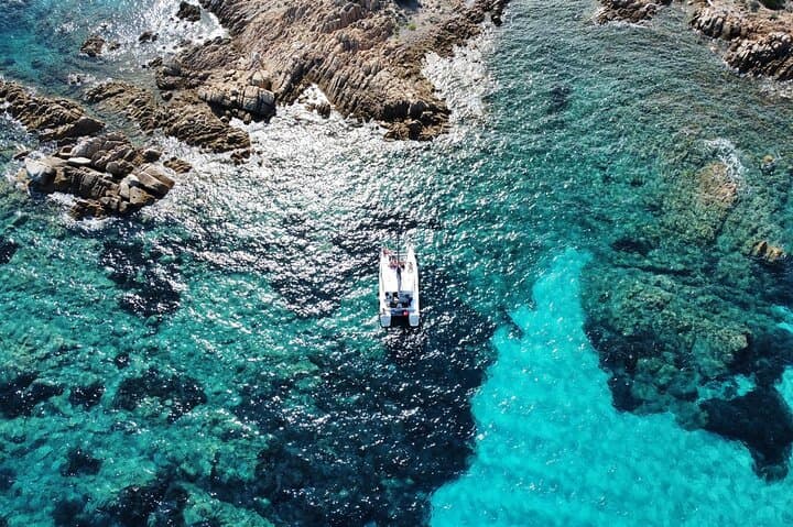 Full-Day Catamaran to La Maddalena Park — Lunch, Snorkeling & Pink Beach Stops photo 1