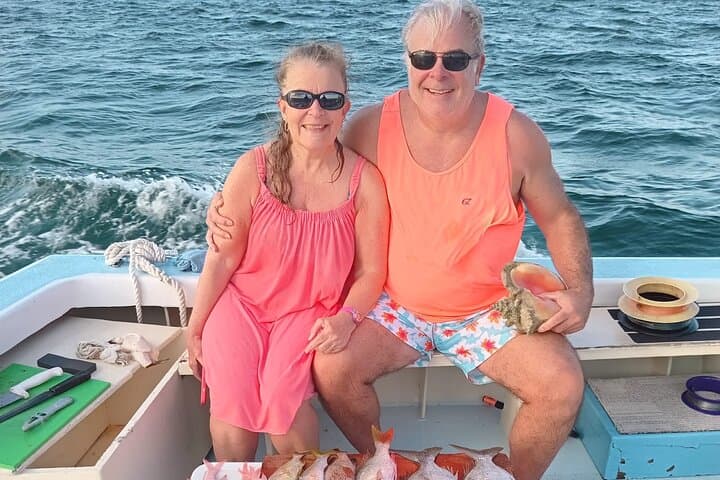 Stingray City and Reef Fishing Tours — Boat Trip to Feed Stingrays and Fish Grand Cayman