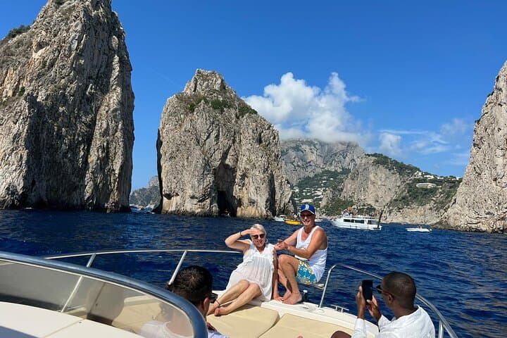 Capri Half-Day Boat Tour: Blue Grotto, Faraglioni & Snorkel with Local Captain photo 1