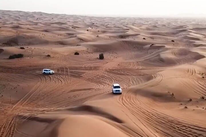 Dubai Desert Safari: Dune Bashing, Sandboarding & Bedouin BBQ Experience photo 2