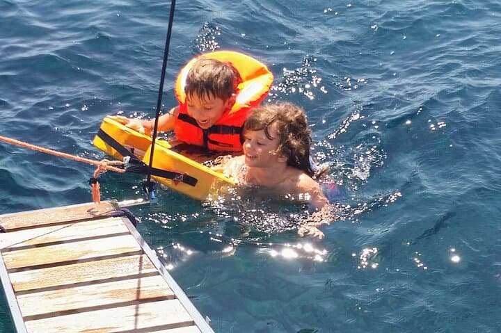 Santorini Volcano Sailing: Semi-Private Morning & Sunset Cruise to Hot Springs, Red & White Beaches photo 4