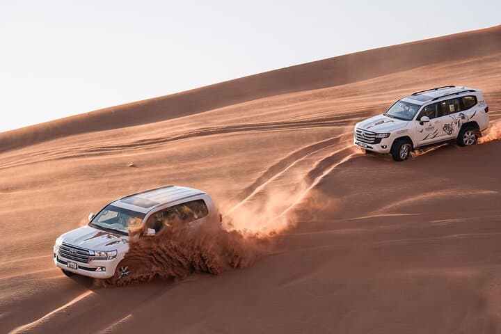 Dubai Red Dune Sunset Safari — Sandboarding, Dune Bashing & Camel Ride Experience photo 4