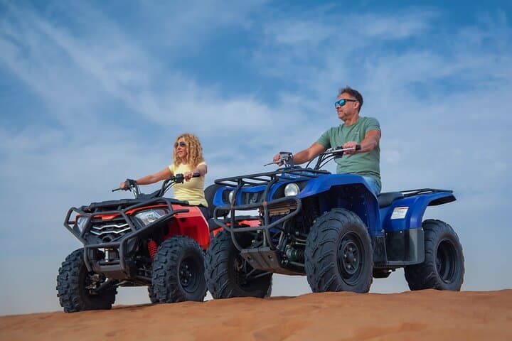 Red Dunes Quad Bike & Evening Desert Safari with BBQ and Live Shows in Dubai photo 1