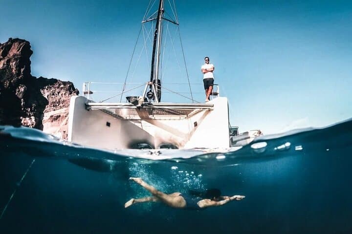Santorini Full-Day Catamaran to Ios — Red Beach, Volcano & Sunset Cruise