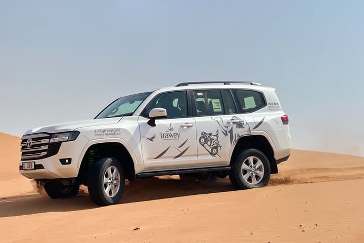 Dubai Red Dune Sunset Safari — Sandboarding, Dune Bashing & Camel Ride Experience photo 2