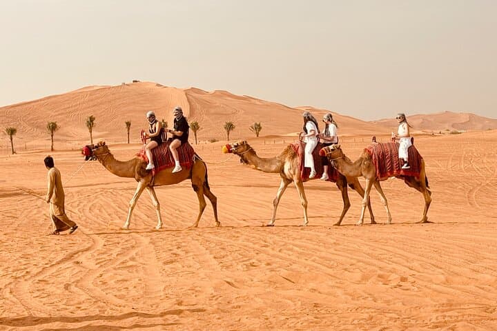Dubai Red Dunes Sunrise & Sunset Desert Safari with Camel Ride, Falconry and Sandboarding photo 2