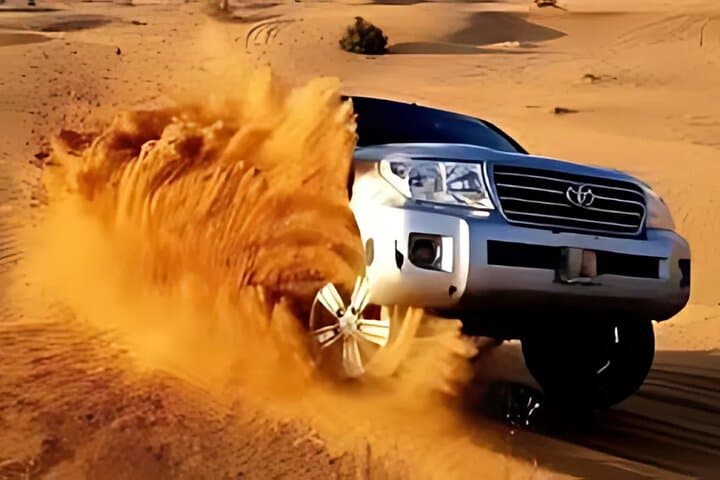 Dubai Desert Safari: Dune Bashing, Camel Rides & Bedouin BBQ Experience photo 2