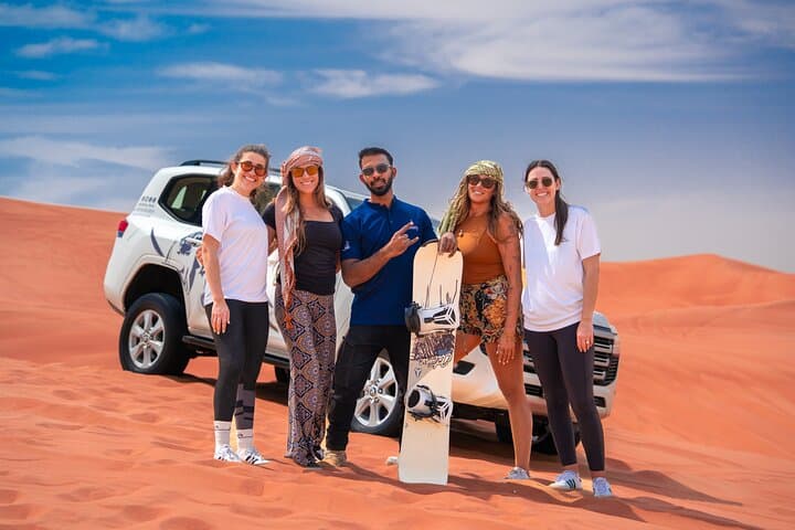 Sunset Dubai Desert Safari with Pro Photographer: Dune Bashing & Camel Rides photo 4