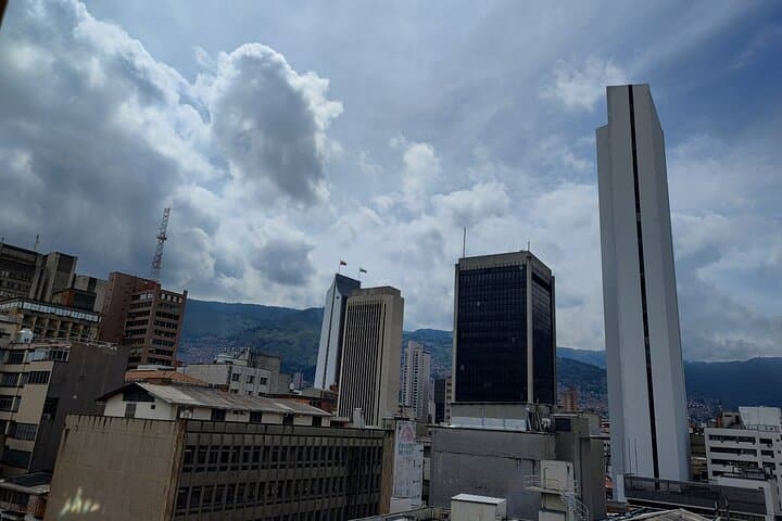 Medellín Walking Tour: Market Flavors, Cable Car Views & Cultural Landmarks photo 1