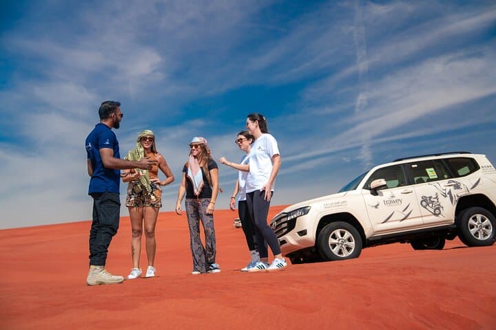 Sunset Dubai Desert Safari with Pro Photographer: Dune Bashing & Camel Rides