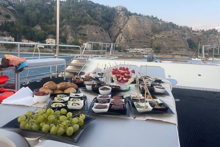 Sunset Boat Excursion in Taormina: Isola Bella, Blue Grotto & Mount Etna Views photo 5