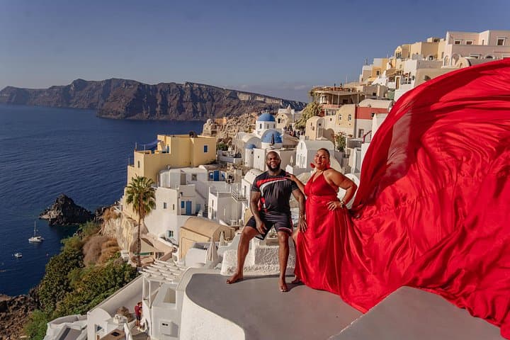 Flying Dress Photoshoot in Oia: Private Blue Dome Experience in Santorini photo 1